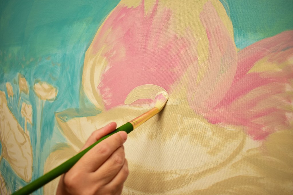Painting the Pink Poppies with layers of acrylic, pinks greens and yellows and teals