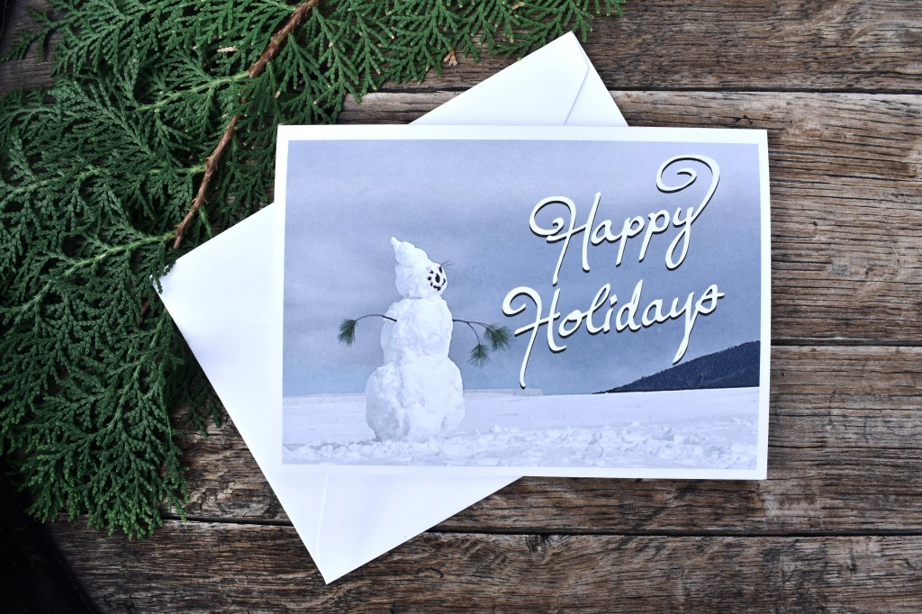 Snowman looking out Happy Holidays Card